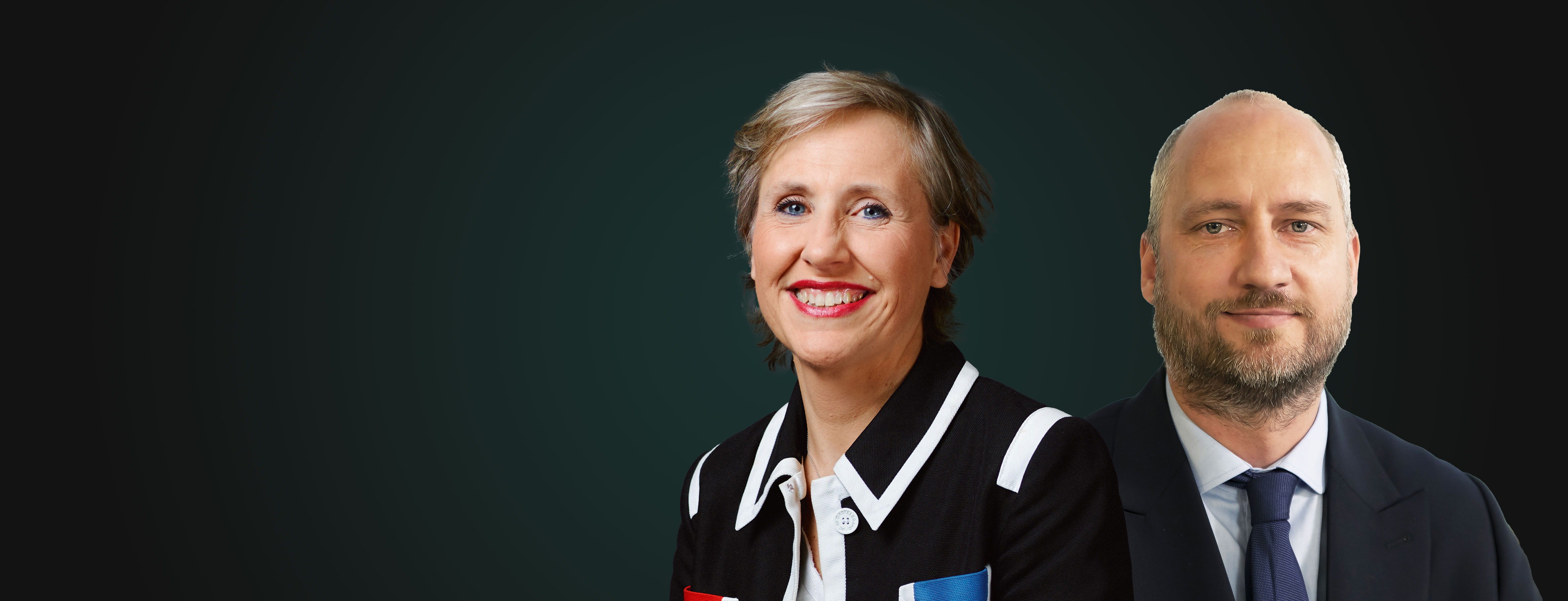 A woman and a man smiling