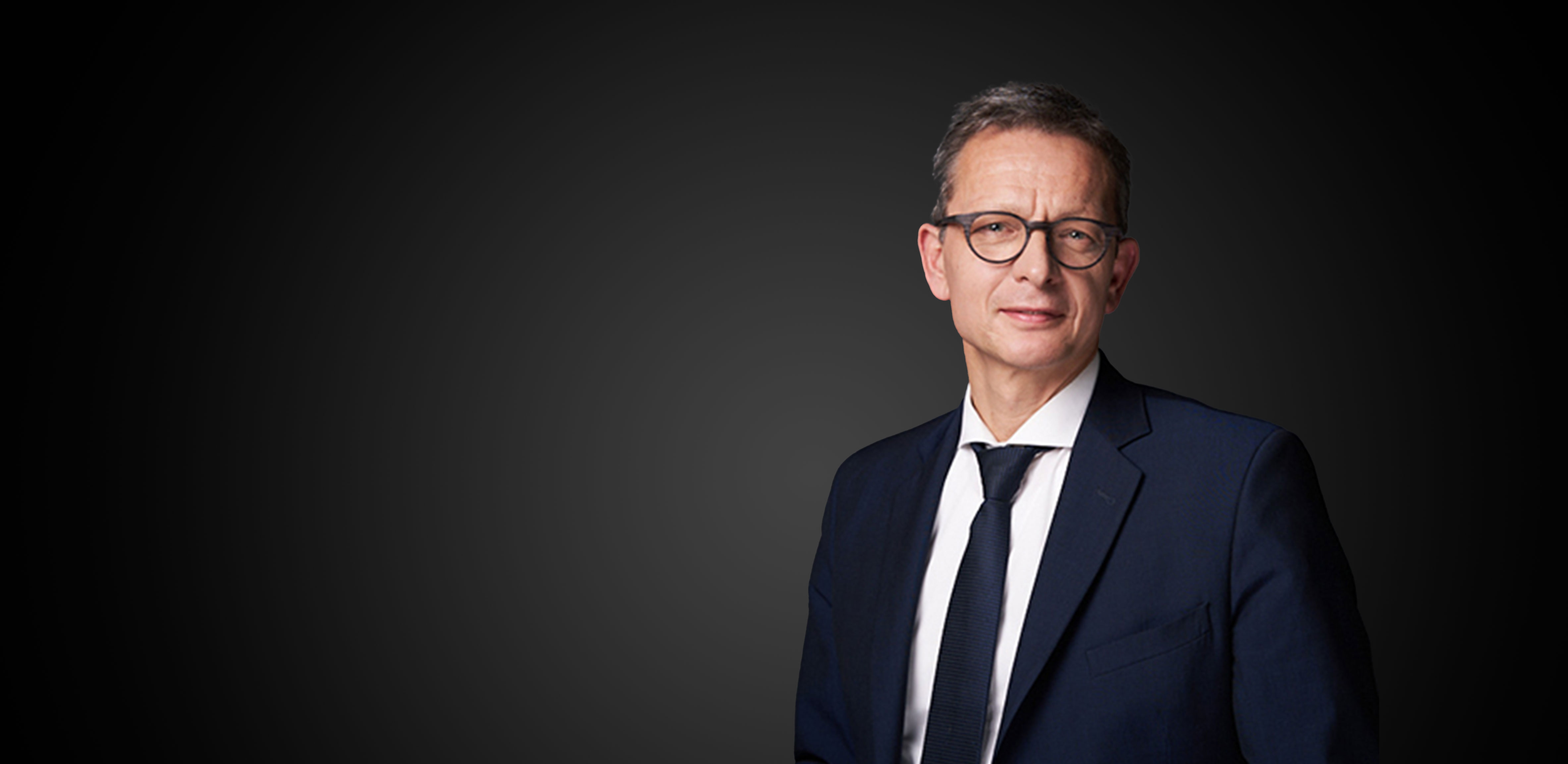 Smiling man dressed in a suit smiling