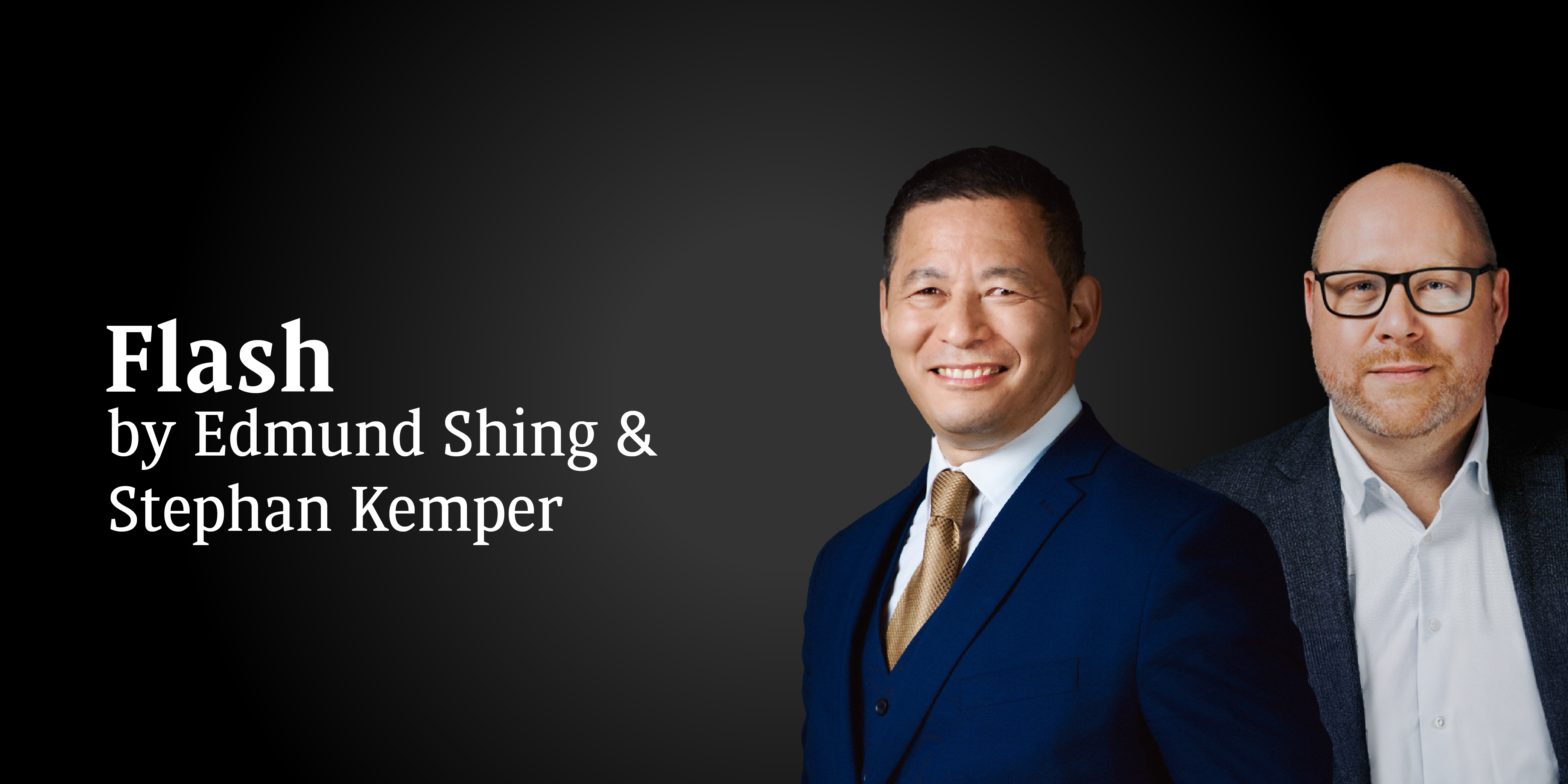 A smiling man dressed in suits